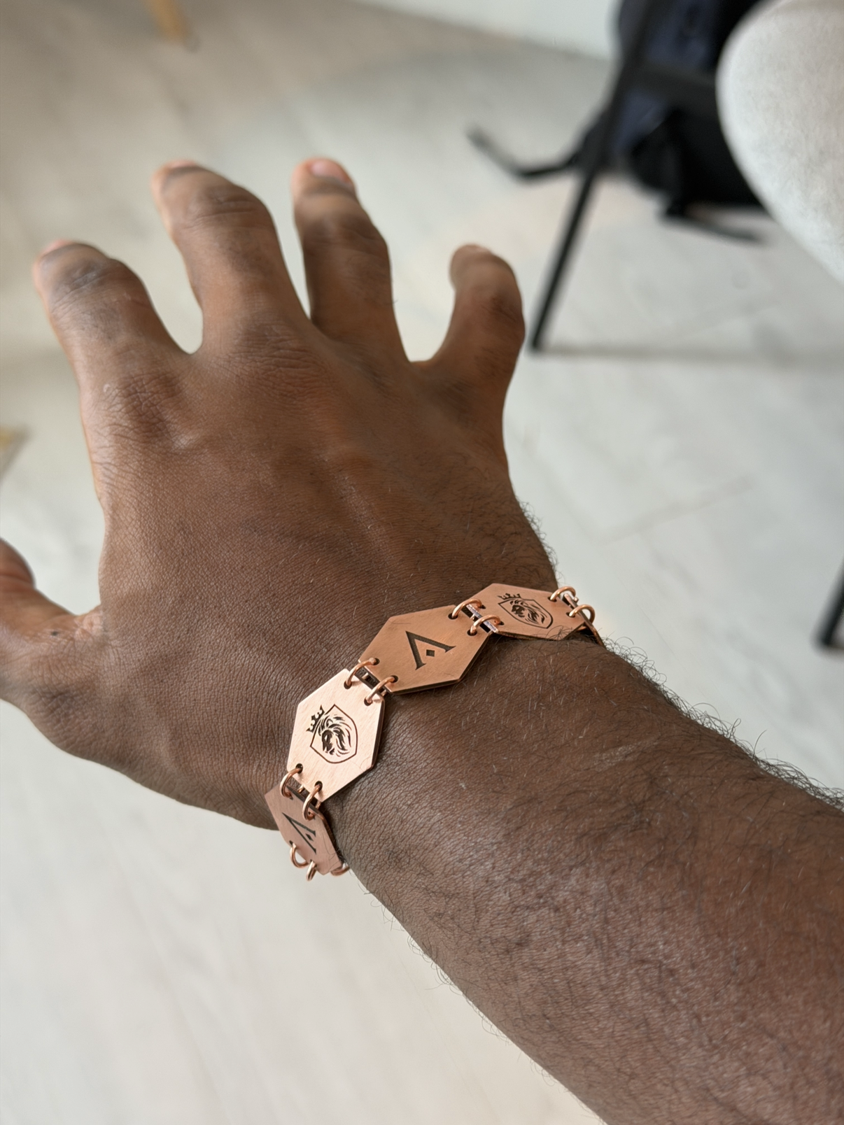 auctori × AlphaSetters hex link bracelet worn on the wrist