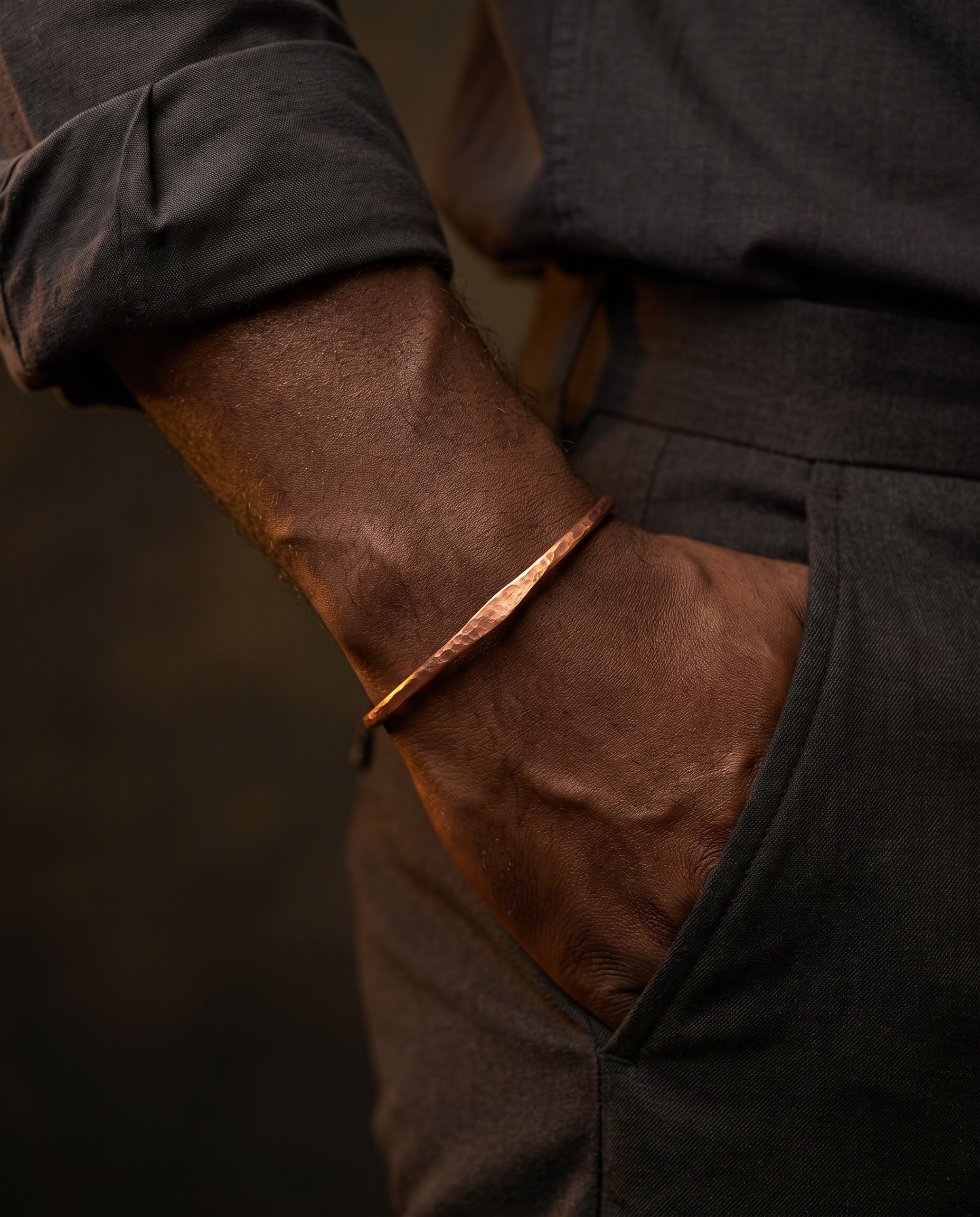 Hammered copper bangle worn on the wrist