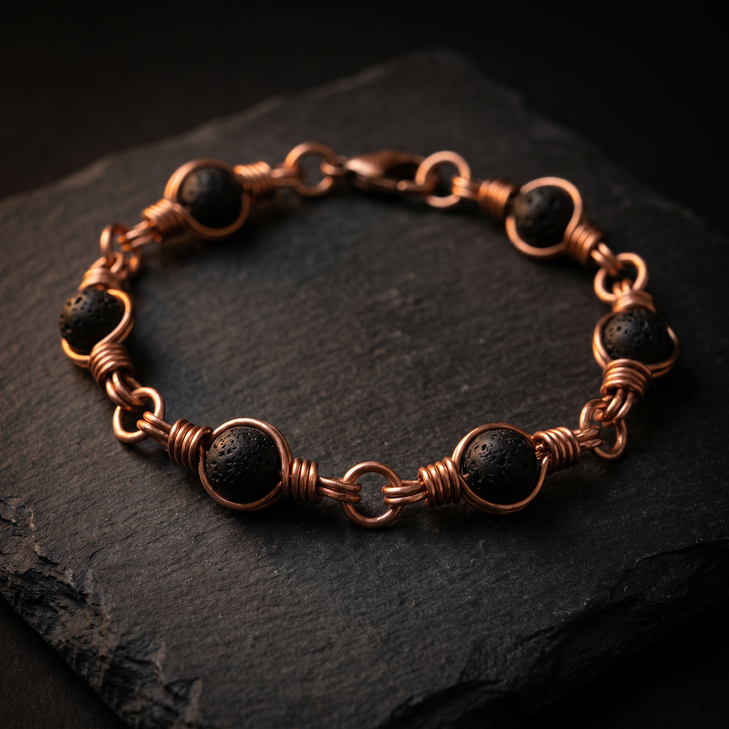 Copper lava stone bracelet on dark slate
