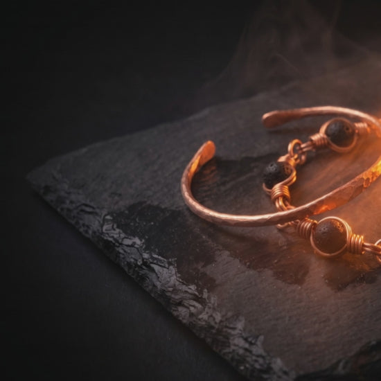 The July Bundle: copper bangle and lava stone bracelet in ember light